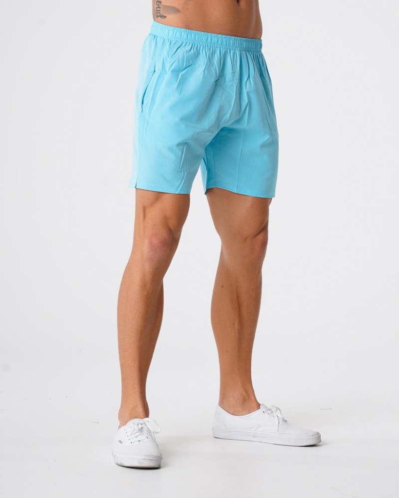 NVGTN Flex Miesten Shortsit Vaaleanturkoosi | FI314WN